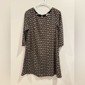 Women’s shift dress in muted red, green, and tan